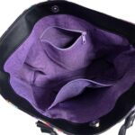 inside of tote bag featured in black and colorful butterflies with purple lining