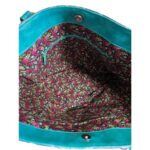 inside of tote bag featuring a teal and mushroom faux leather with colorful lining