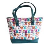 tote bag with colorful puppies and teal accents