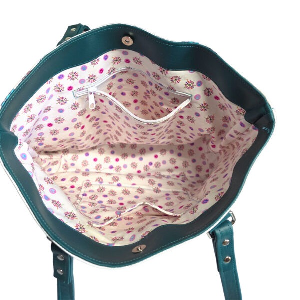 inside of tote bag with colorful puppies and teal accents