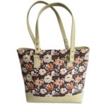 tote bag featuring brown with flowers and cream accents. handmade with faux leather