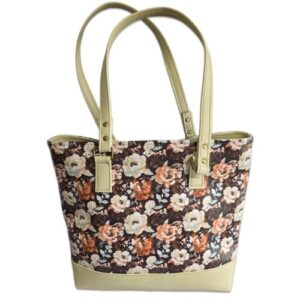 tote bag featuring brown with flowers and cream accents. handmade with faux leather
